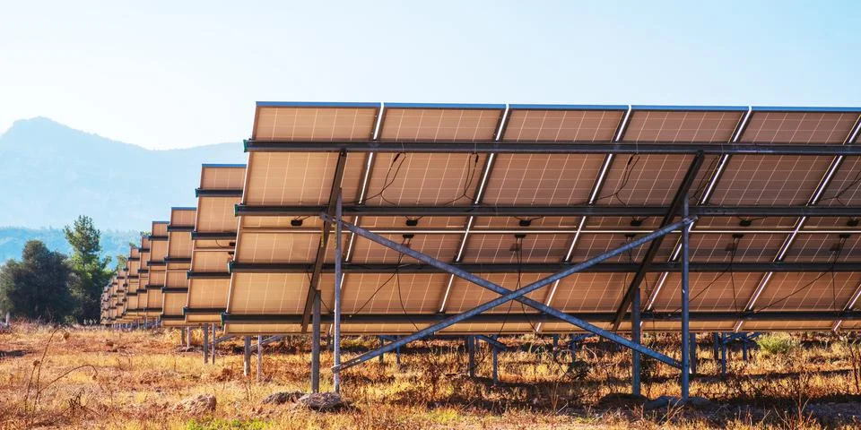 A complex of solar panels for generating electricity. Green energy farm Stock Photos