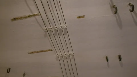 Complex structure of wires leading to bright round lamp Stock Footage 301152818