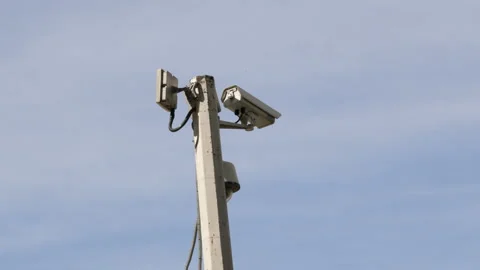 Complex of surveillance cameras installed on pole in city park or city center Stock Footage 235492517