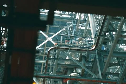 A complex system of pipes and assemblies in a plant for the production and tr Stock Photos