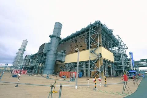 A complex system of pipes and assemblies in a plant for the production and tr Stock Photos
