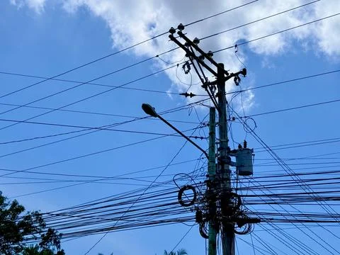 Complex Utility Pole with Wires Against Blue Sky Stock Photos