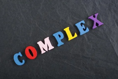 COMPLEX word on black board background composed from colorful abc alphabet .. 写真素材