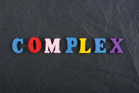 COMPLEX word on black board background composed from colorful abc alphabet .. Stock Photos