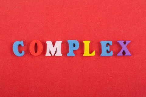 COMPLEX word on red background composed from colorful abc alphabet block wo.. Foto stock