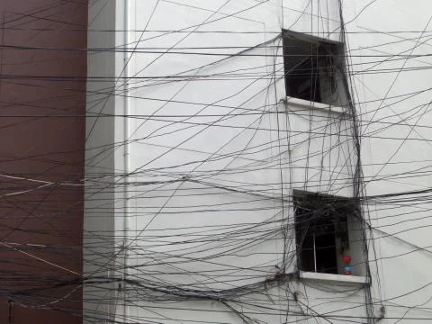 Complexion of optical fiber cable power electric line to building 写真素材