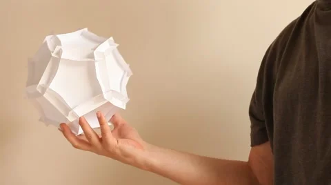 Complexity -paper Dodecahedron in the hand Stock Footage 41451995