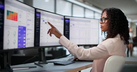 Compliance Manager Analyzes Internal Controls Dashboard Data On Desktop. Stock Photos