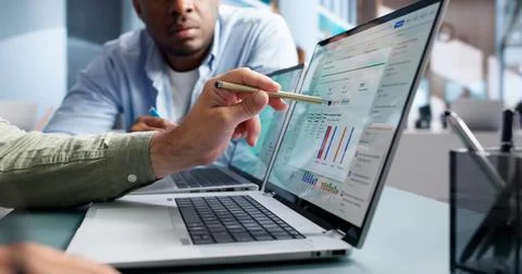 Compliance Officer Analyzes Risk Data On Laptop For Audit Review Tasks. Stock Photos