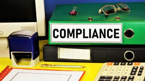 Compliance. Text label on the folder office of the Registrar. Stock Photos