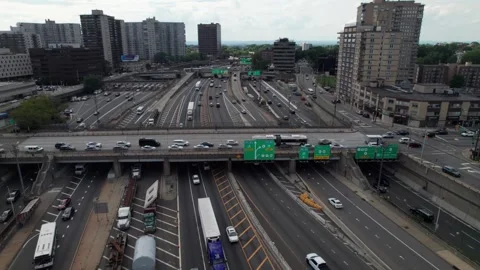 Complicated traffic pattern with signs, highways, trucks and cars, 4K Stock Footage 248054343
