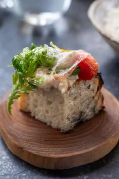 Compliment from chef in restaurant amuse-bouche with homebaked bread biscui.. 库存照片