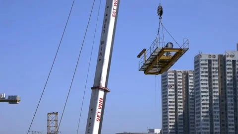 A component of a crane is lowered. Stock Footage 145793354