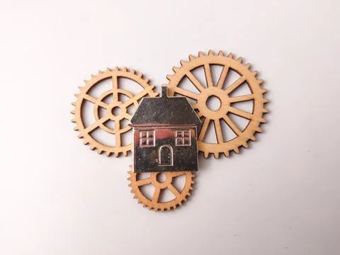 The components consist of three laser-cut wooden gears and one metallic hou.. Stock Photos