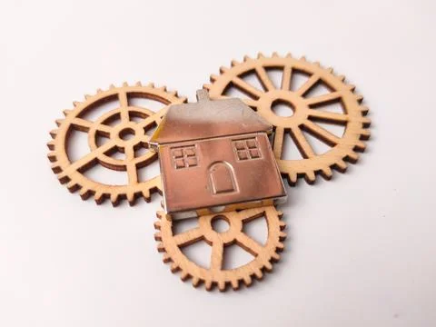 The components consist of three laser-cut wooden gears and one metallic hou.. Stock Photos