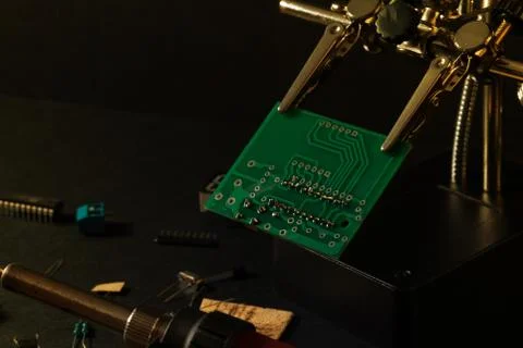 The components of the main board in the process of assembling the device Stock Photos