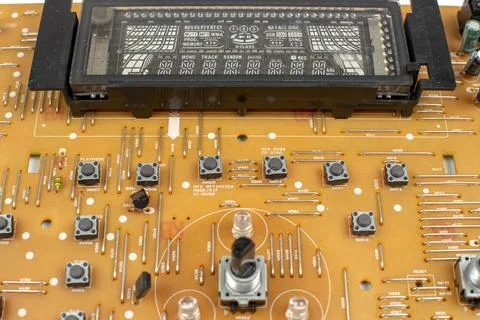 Components of microprocessor devices are installed on a printed circuit board Foto stock