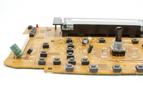 Components of microprocessor devices are installed on a printed circuit board Foto stock