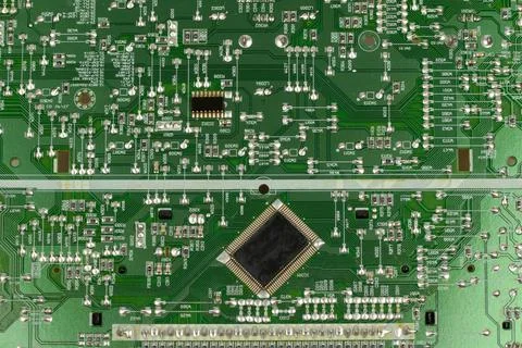 Components of microprocessor devices are installed on a printed circuit board 写真素材