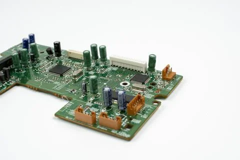 Components of microprocessor devices are installed on a printed circuit board Stock Photos