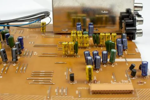 Components of microprocessor devices are installed on a printed circuit board 写真素材