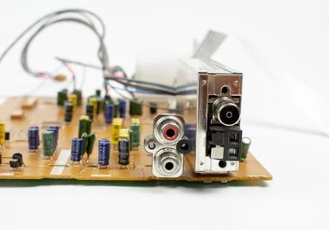 Components of microprocessor devices are installed on a printed circuit board Stock Photos