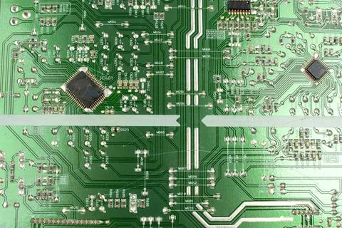 Components of microprocessor devices are installed on a printed circuit board 写真素材