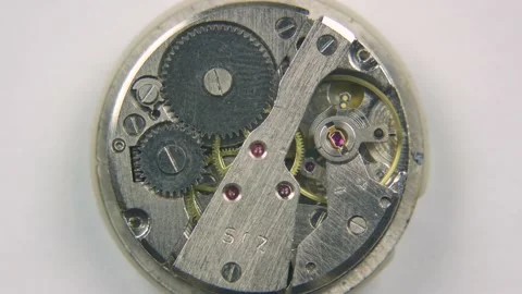 Components of old watch mechanism. Top view vintage clock mechanism working Stock-Footage 139958477
