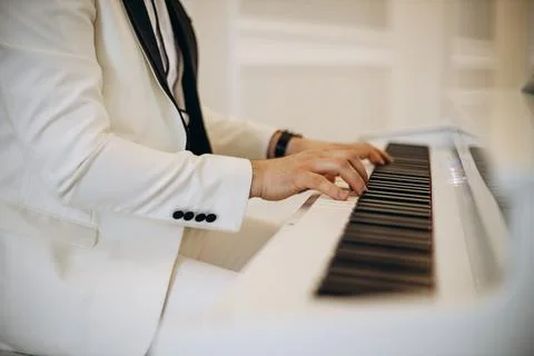 Composer playing the piano at the wedding Stock Photos