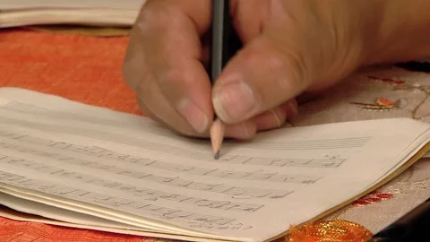 Composer Writing Music Using a Pencil. Close Up. Stock Footage 119617228