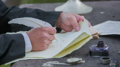 Composer writing a poem at stone table Stock Footage 46873227