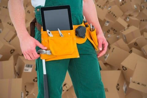 Composite 3d image of construction worker wearing tools belt Foto stock