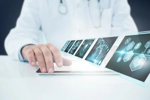 Composite 3d image of doctor using digital tablet against white background Foto stock