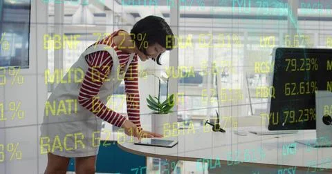 Composite of financial data processing over businesswoman using computer in.. 스톡 사진