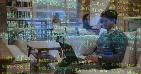 Composite of financial data processing over caucasian businessman using laptop Stock Photos