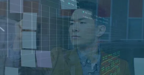 Composite of financial data processing over asian businessman in office Stock Photos