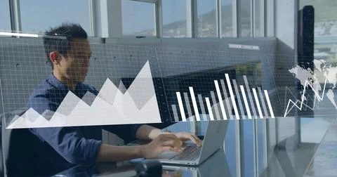 Composite of financial data processing over asian businessman using laptop Stock Photos