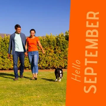 Composite of hello september text over caucasian couple with dog in garden Fotos Stock