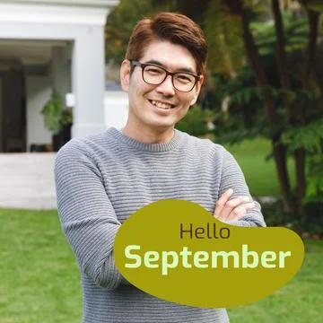 Composite of hello september text over smiling asian man in garden Fotos Stock