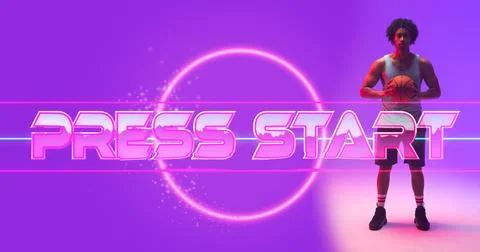 Composite of illuminated press start text and circle by biracial male player Stock Photos