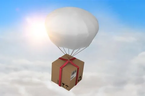 Composite image of 3d composite image of parachute carrying cardboard box Foto stock