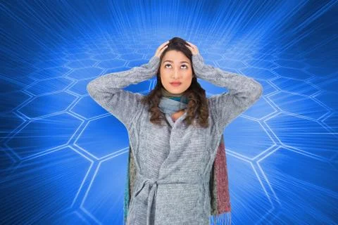 Composite image of anxious pretty brunette wearing winter clothes posing Illustrazione stock