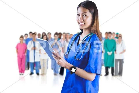 Composite Image Of Asian Nurse Using Tablet