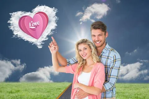Composite image of attractive young couple embracing and pointing Ilustração Stock