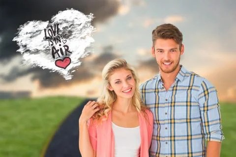 Composite image of attractive young couple smiling at camera Ilustração Stock