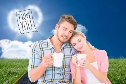 Composite image of attractive young couple sitting holding mugs Ilustração Stock
