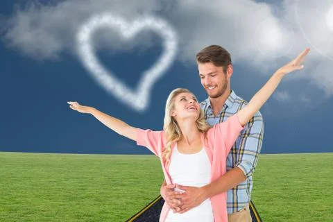 Composite image of attractive young couple smiling and embracing Ilustração Stock
