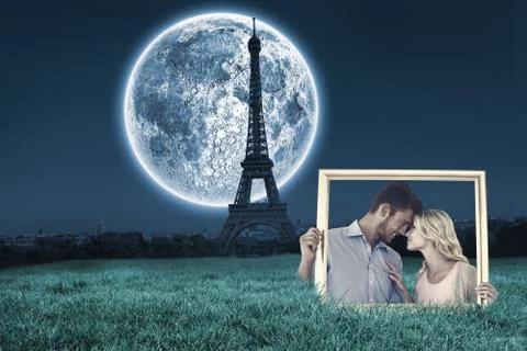Composite image of attractive young couple holding picture frame Stock Illustration