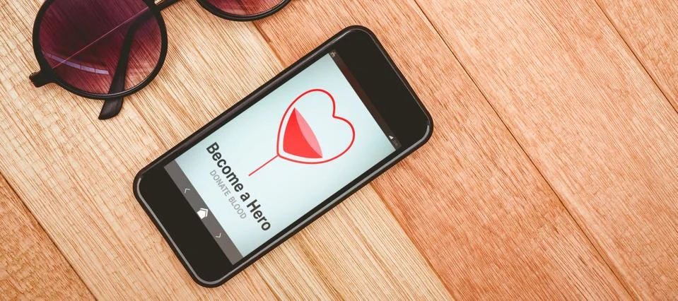 Composite image of become a hero text with heart shape on screen Stock Photos