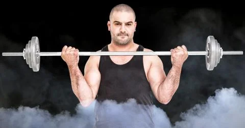 Composite image of bodybuilder lifting heavy barbell weights Foto stock